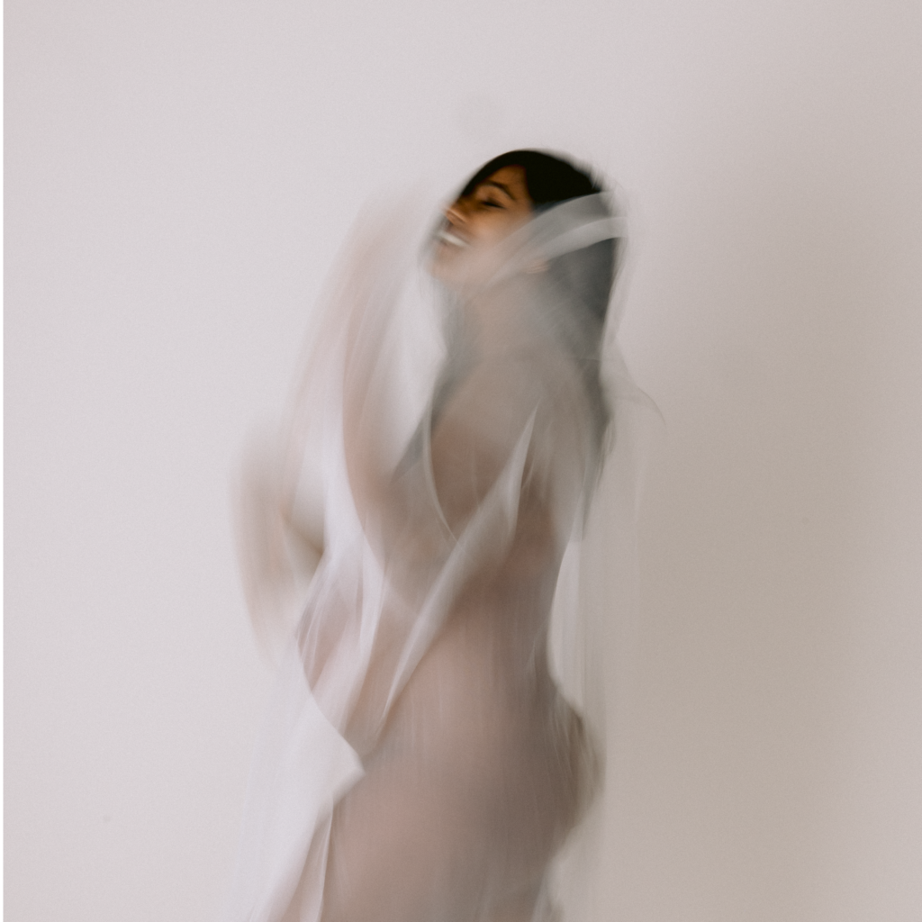 Candid maternity moment with blur, photographed by Kristen Cook in her Melbourne studio
