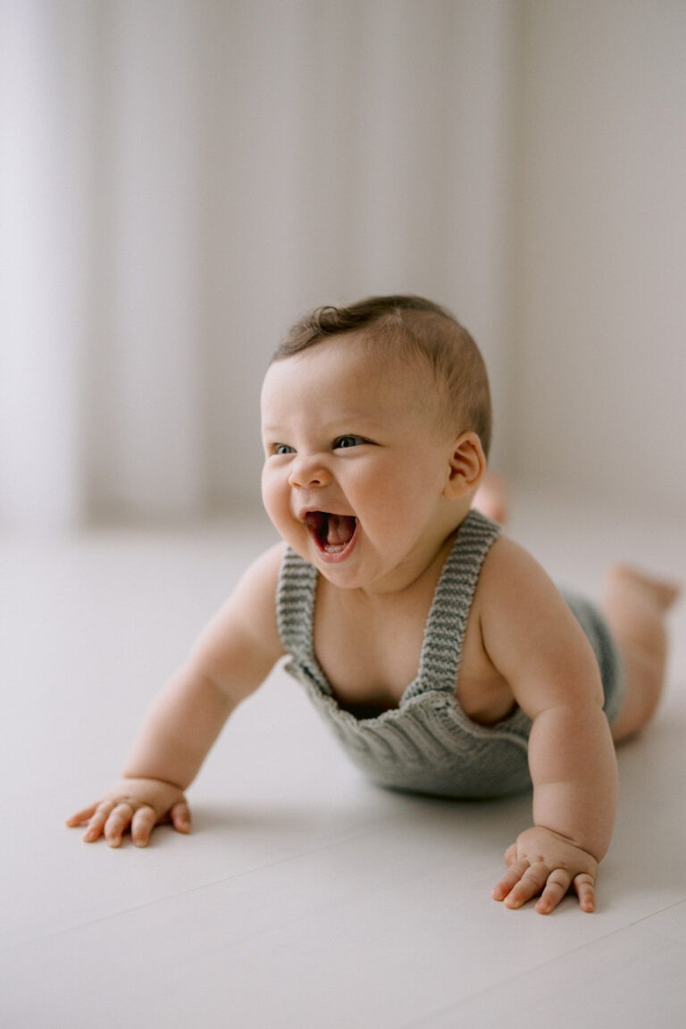 Candid baby laughter, photographed by Kristen Cook in her Melbourne studio