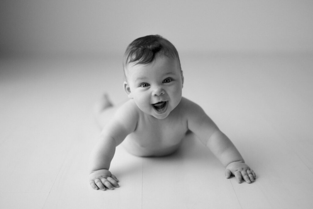 Happy baby laughs during a session with Kristen Cook in her Melbourne studio