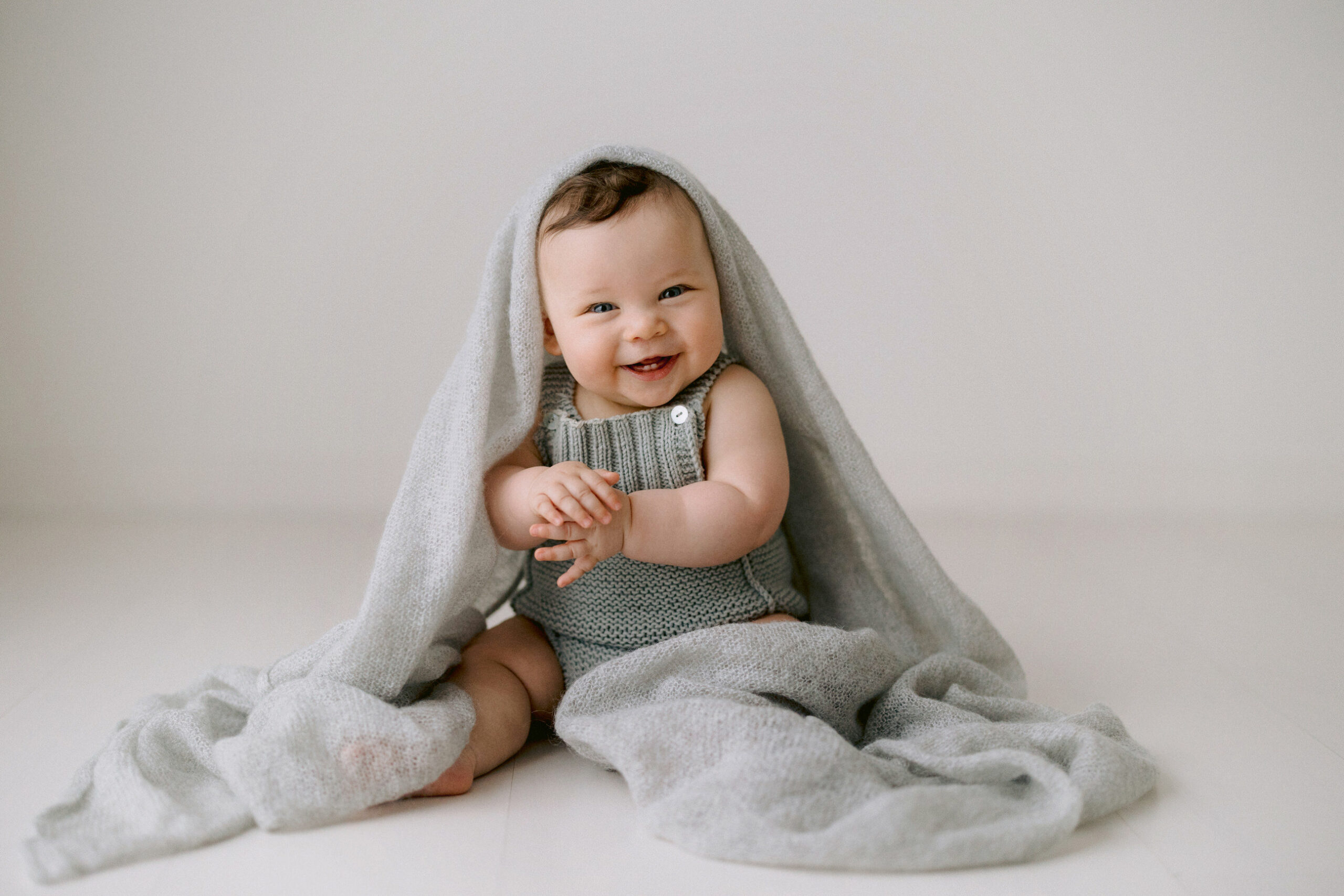 Lots of fun and giggles to be had during baby photography sessions with Kristen Cook